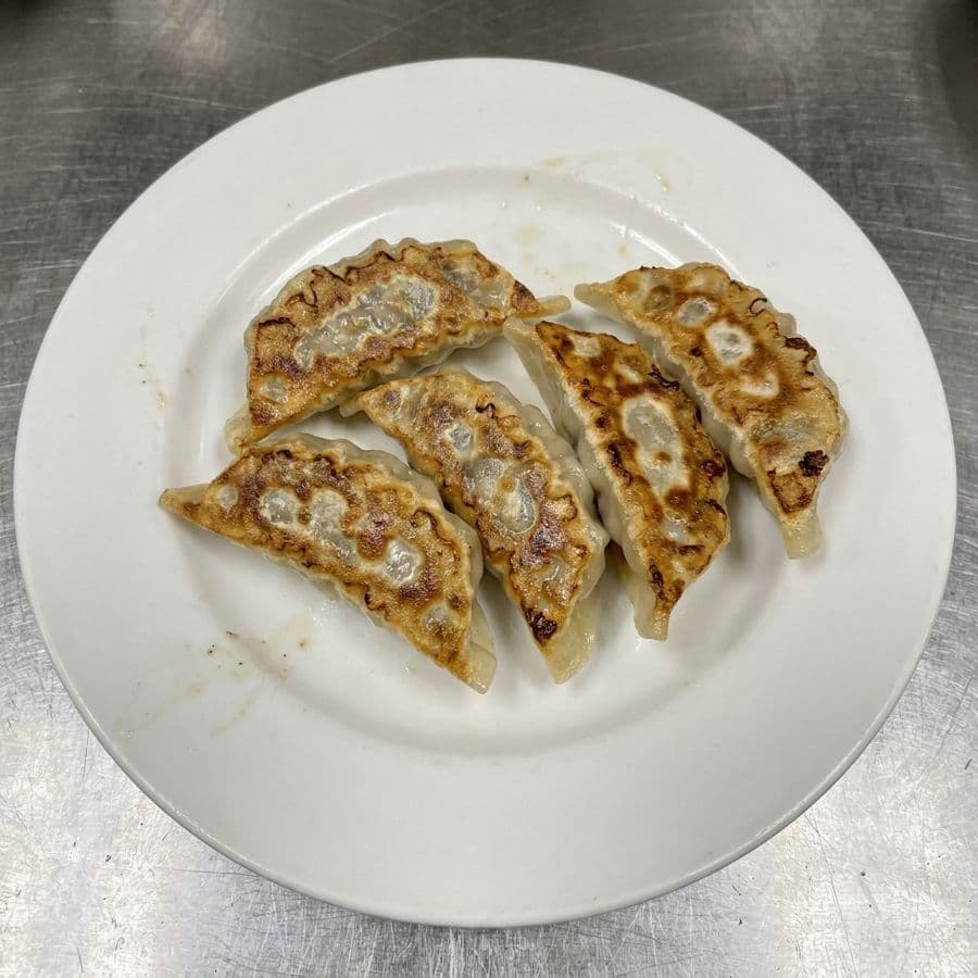 15. Pan Fried Pork Dumpling (4 pcs)