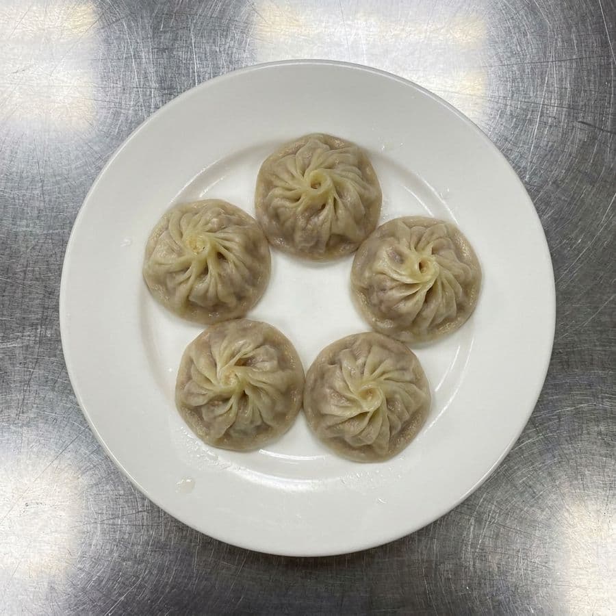 11. Steamed Juice Pork Bun (4 pcs)